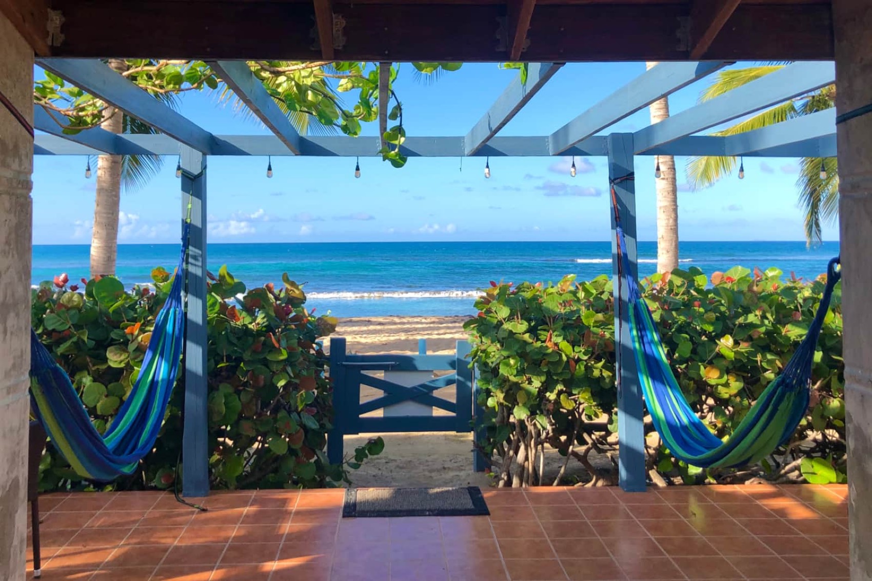 Private oceanfront patio with hammocks looking out to the Caribbean Sea at Paradise Cove Suites, Vieques